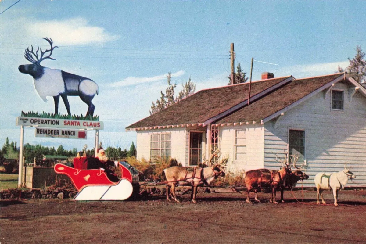 This exterior image features a large reindeer statue and sleigh in front of the house, evoking a sense of whimsy and tradition. The house is visible, grounding the gathering space in a unique, memorable setting that connects with the idea of group celebrations and making new traditions.
